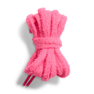 Replacement sneaker laces in bright pink, bundled with textured fabric covers
