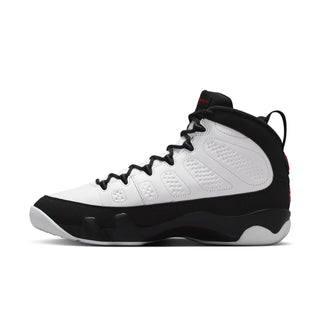 White and black high-top sneaker with red eyelet accents and lace-up closure