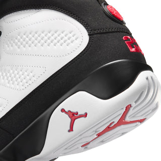 Close-up of black and white high-top sneaker side with red Jumpman logo