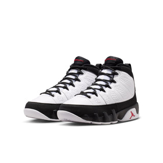 Youth mid-top sneakers, white uppers with black toe and red Jumpman heel detail
