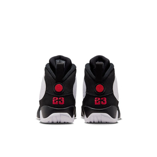 Youth mid-top sneakers from the back, black heel with red '23' logo accents