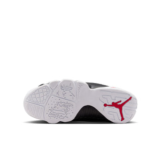 Youth sneakers outsole view, white rubber tread with red Jumpman markings