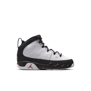 Kids high-top sneakers, white upper with black trim and red accents, lace-up style.