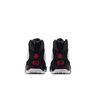 Kids high-top sneakers back view, black heel with red 23 logo and pull tabs.