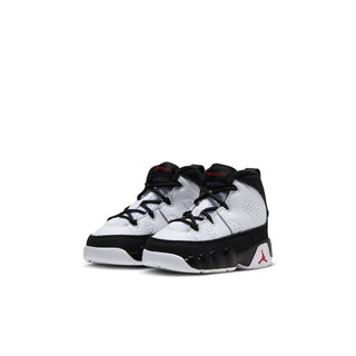 Toddler high-top sneakers, white upper with black collar and red Jumpman logo, lace-up.