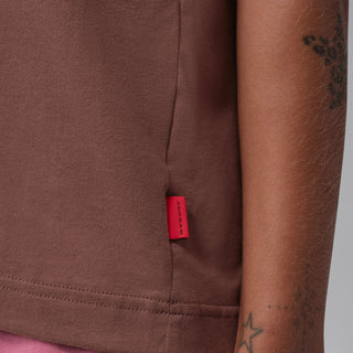 Brown tee close-up of hem seam with red size label