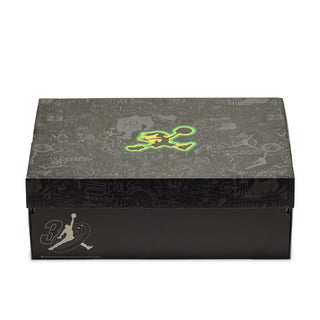 Black and gray Jordan shoe box with Jumpman logo in yellow and neon green