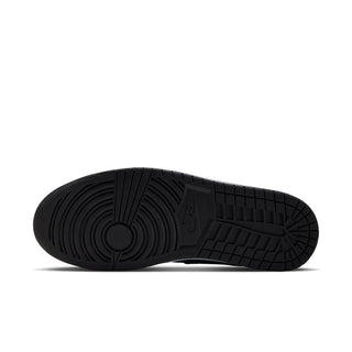 Outsole view of navy mid-top sneakers with textured black rubber tread