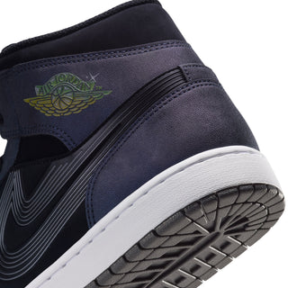 Close-up side of navy mid-top sneakers with embroidered wing logo and ribbed swoosh panel