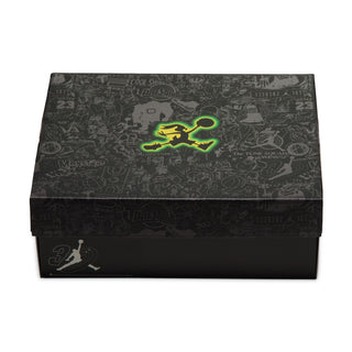 Closed black Air Jordan shoe box with graphic print and bright green emblem