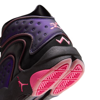 Close-up of sneaker heel with purple panel, pink logo and pink outsole tread