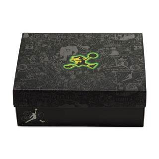 Youth sneaker shoe box with dark pattern and neon green Jordan logo on top