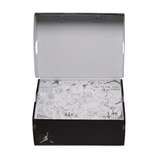 Open youth sneaker box with patterned graphic lining and product label inside