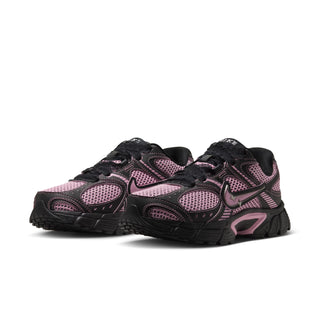 Women’s lace-up running sneaker, black and pink, with textured mesh uppers and tread sole