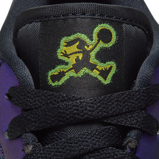Youth AJ 1 Low SE tongue close-up with neon green Jumpman-style graphic