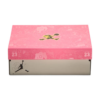 Youth sneaker box with light pink lid and Jumpman-style graphic, multi-color print
