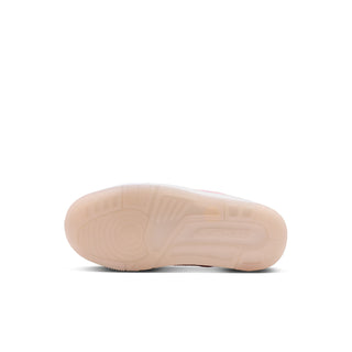 Translucent pale pink outsole of a kids' high-top sneaker
