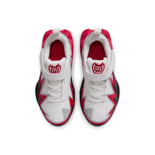 Kids' sneakers with white uppers and red tongue logo visible from top view