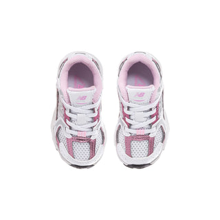 Toddler sneakers front view, white leather with pink trim and lace-up closure