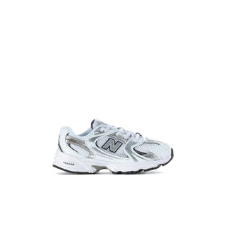 Toddler New Balance sneakers, white with navy N logo, side view on one shoe