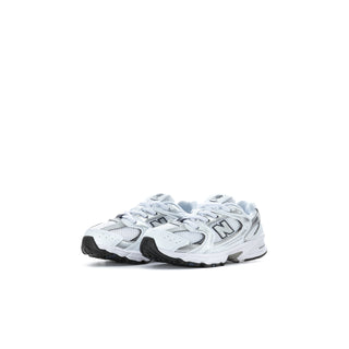 Toddler New Balance sneakers in white with navy accents, side profile pair