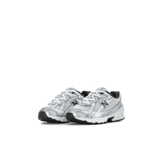 Pair of toddler silver metallic sneakers with black trim, lace-up front, and side 'N' logos