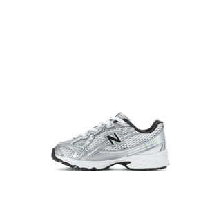 Toddler silver metallic sneakers with black trim, lace-up, and 'N' logo on side