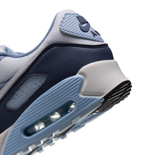 Men's Air Max 90 midsole close-up with navy side panel and blue air window