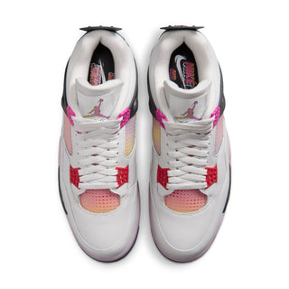 Men's sneakers, front view: white uppers with red lace tabs and pink perforated toe panel