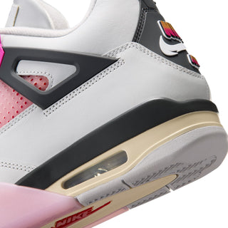 Men's sneaker close-up: black midfoot panel, beige outsole, visible Air window and stitching