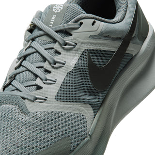 Close-up of gray mesh upper, laces, and black swoosh on Nike Run Swift 3