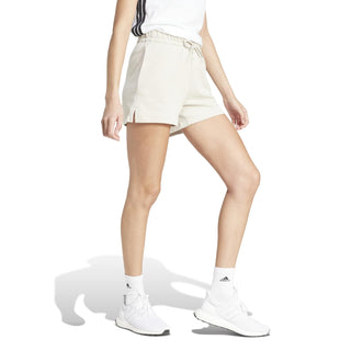 Women's off-white cotton shorts, rear-side view with elastic waistband