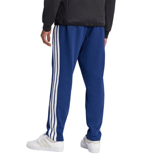 Men's dark blue fleece pants with white three-stripe design and elastic cuffs