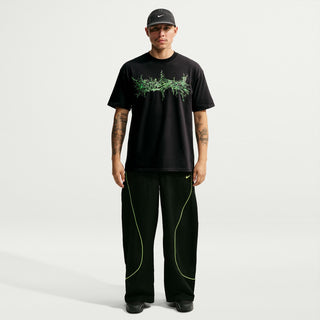 Mens black T-shirt featuring neon green dripping graphic on the chest