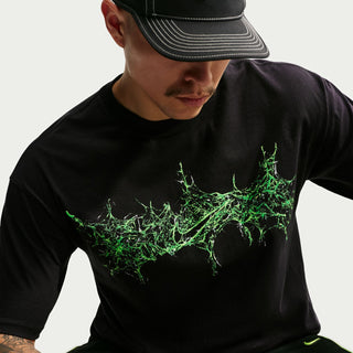 Mens black T-shirt with neon green dripping splatter graphic on chest
