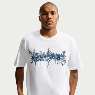 Men's white crew-neck T-shirt with blue splatter chest graphic, front view