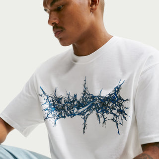 Men's white crew-neck T-shirt with blue splatter graphic detail on chest
