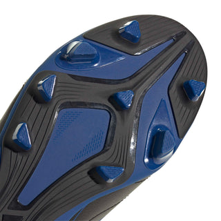 Close-up of blue-black rubber outsole with molded traction studs for firm play