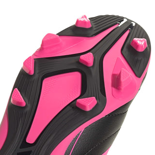 Youth soccer cleat outsole detail with black traction and hot-pink studs