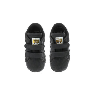 Infant black adidas Superstar sneakers, heel view with adidas logo and straps