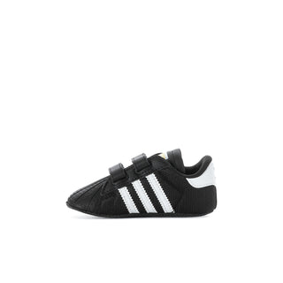 Infant black adidas Superstar sneaker with white three stripes and white heel panel