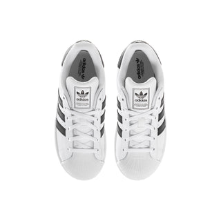 Kids' white adidas sneakers with black heel stripes and adidas logo on tongue.