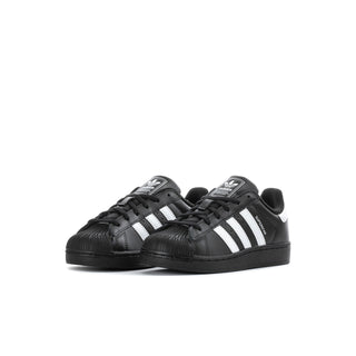 Kids' black adidas sneakers, front view with white three-stripe panels
