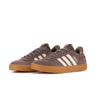 Women’s suede court sneaker pair, taupe uppers with white adidas stripes and gum sole