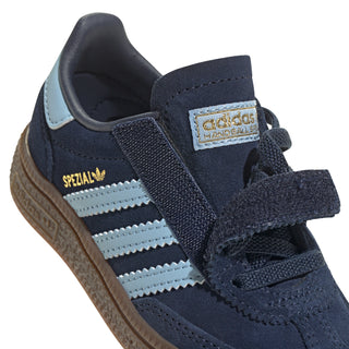 Toddler navy sneaker with light blue stripes, hook strap detail, gum sole