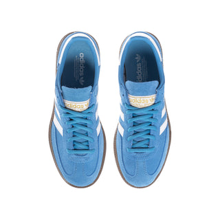Pair of light blue youth adidas sneakers, blue laces, white toe panel, brown sole
