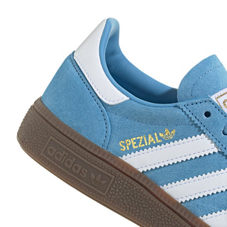 Light blue youth adidas sneaker with white stripes and brown gum sole, suede upper