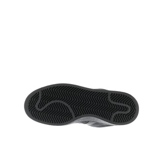 Youth black sneaker outsole with textured zigzag tread pattern
