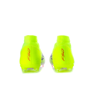 Men's mid-cut football boots, neon yellow heels with red logo, FG studs