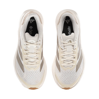 Women's white running shoes, front view with lace-up closure and padded collar